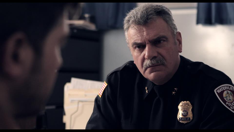 Rick Zahn As Police Officer